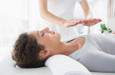 woman receiving Reiki treament