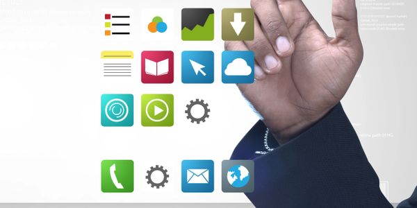 Hand interacting with colorful digital app icons floating on a transparent interface.