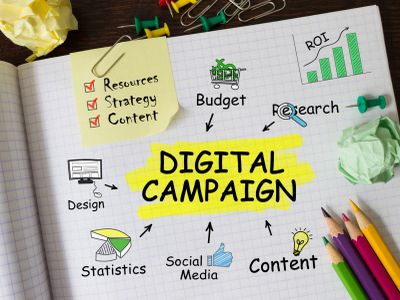 Illustration of key elements in a digital campaign with colorful pencils and office supplies.