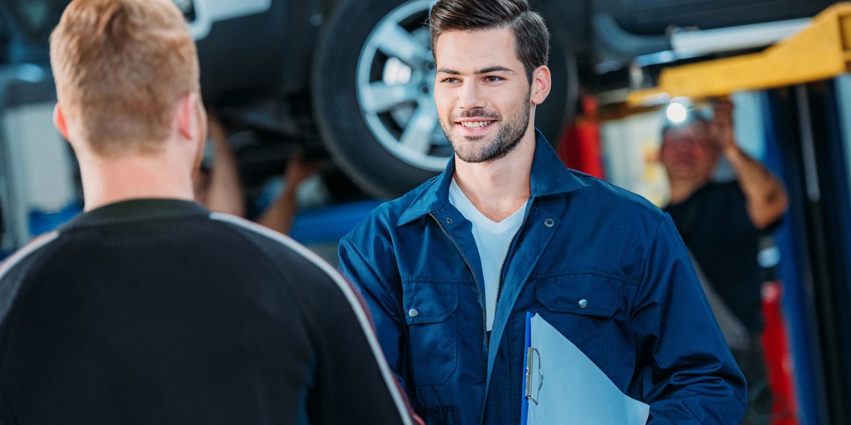 Mechanic meets with customer.  