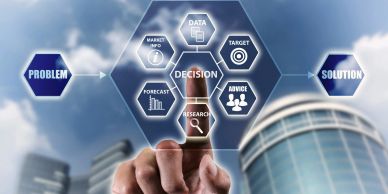 Person interacts with decision-making flowchart on transparent screen.