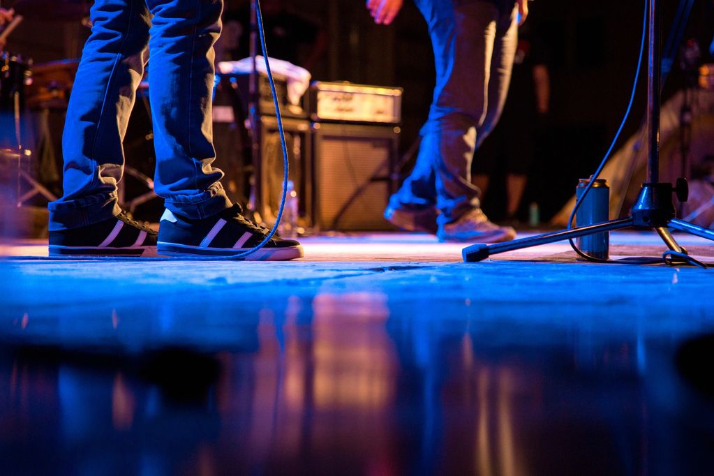 Vibrant band performance under colorful lights.