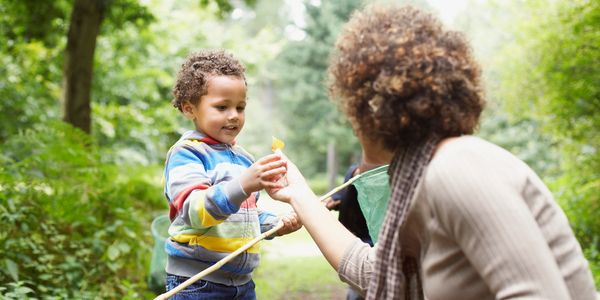 Children exploring outdoors with curiosity