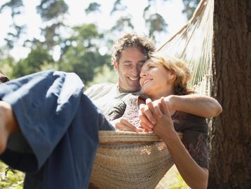 couple in Owasso in a hammock feeling great with functional medicine, primary care, and hormones