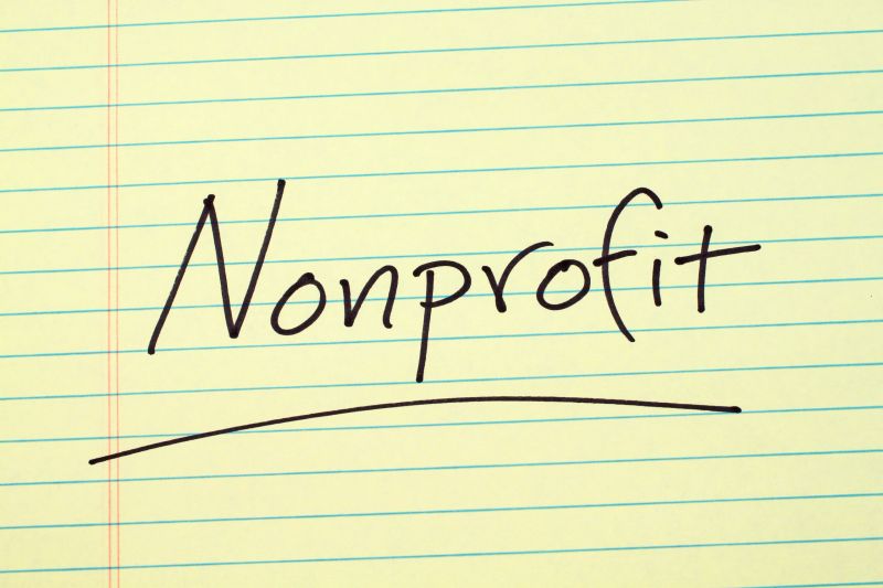 The word "Nonprofit" underlined on a yellow legal pad