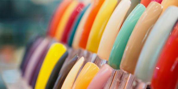 Close-up of colorful nail polish swatches arranged in a row.