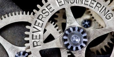 Close-up of gears with 'REVERSE ENGINEERING' text.