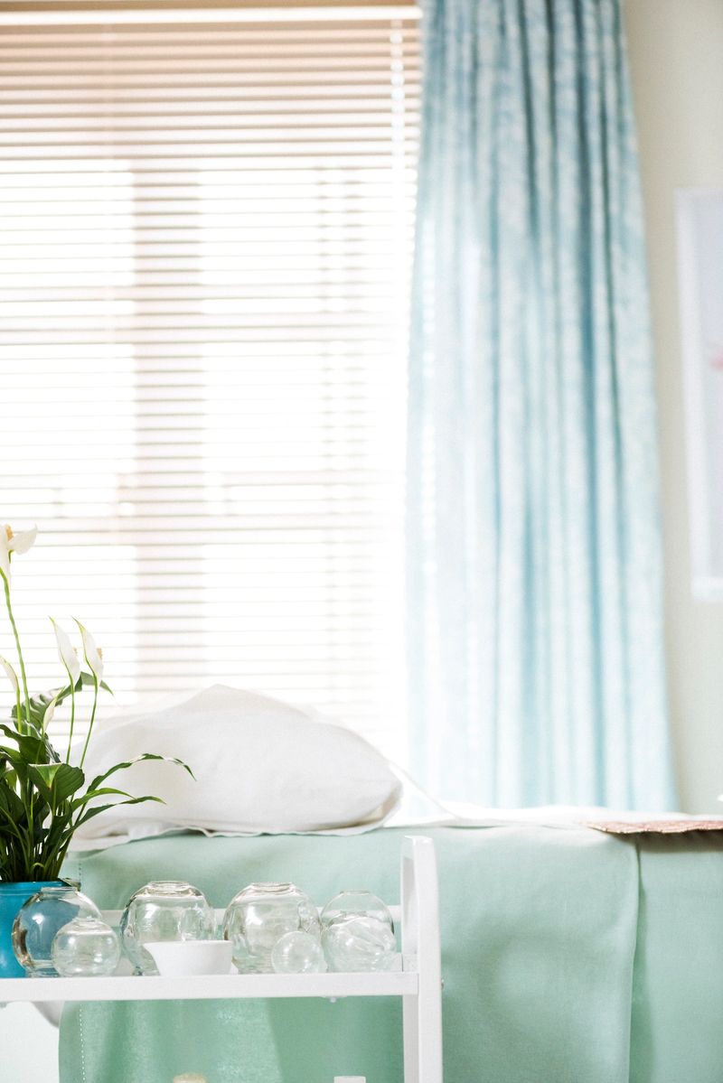 Alternative therapy examination bed with cups on a table for cupping treatment. Alternative Medicine