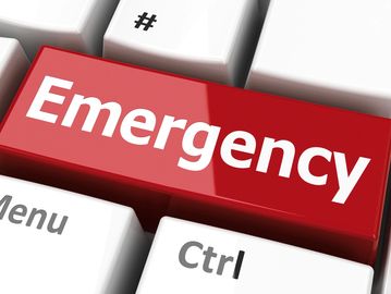 Red emergency key on a keyboard.