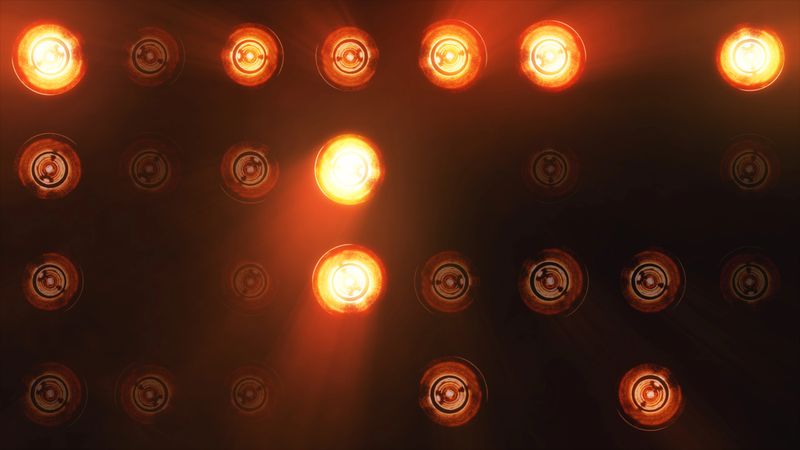 The wall of incandescent lamps is bright. LED background