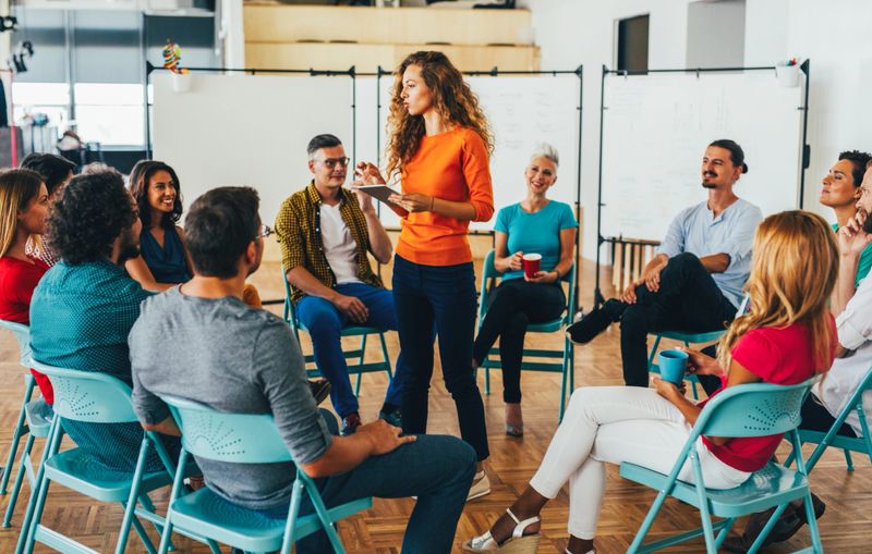 Businesswoman giving presentation on future plans to her colleagues.