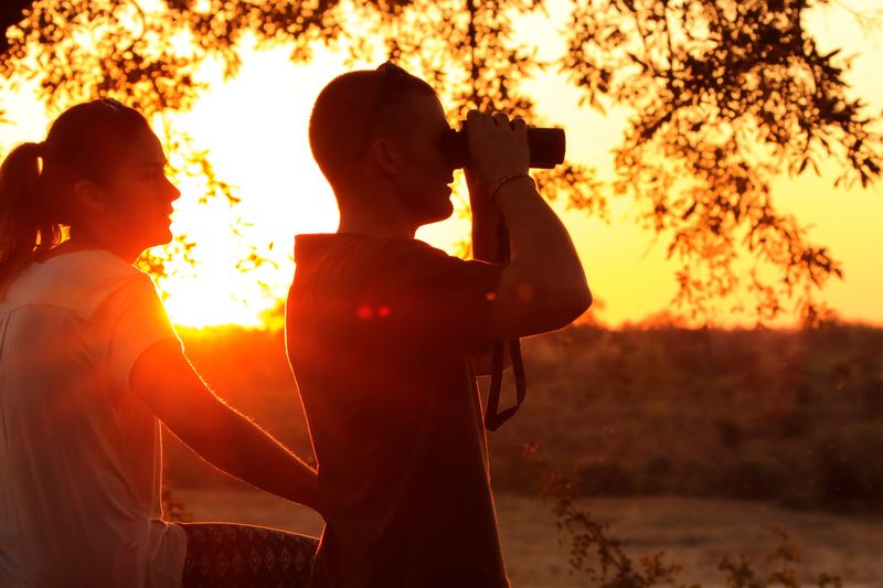 People sunset couple sunrise safari viewpoint Africa nature man binoculars woman love outdoors home