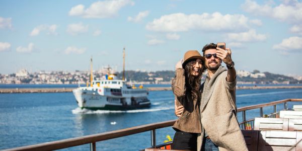 A couple is taking a selfie. 