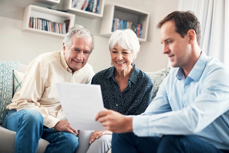 Shot of a senior couple getting advice from their financial consultant at home