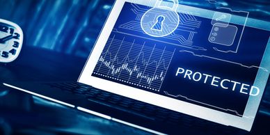 Laptop screen displaying cybersecurity protection with a lock icon and data graphs.