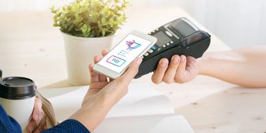 Contactless payment via smartphone using a POS terminal.