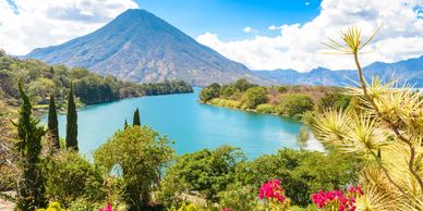 Stunning Lake Atitlán surrounded by volcanoes and traditional Mayan villages,  and natural beauty. 