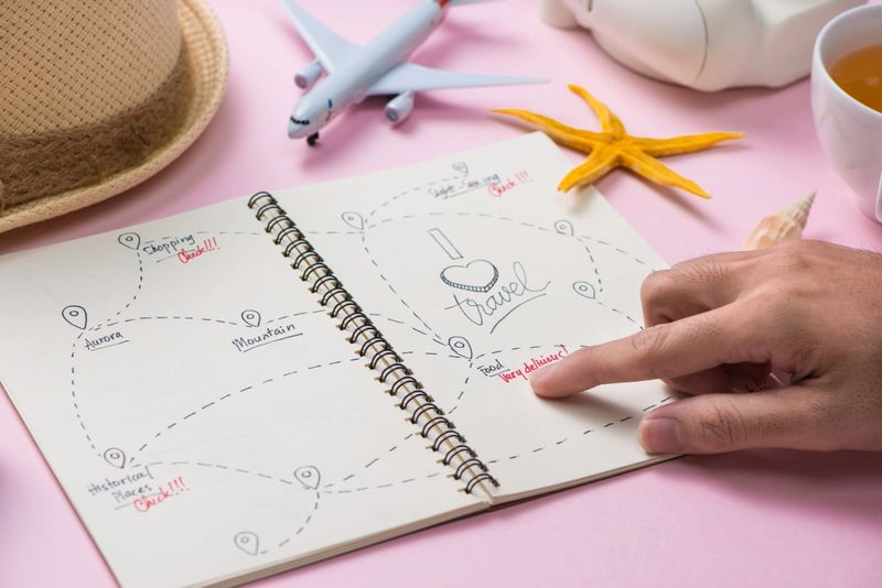 Hand choosing the route for your summer vacation