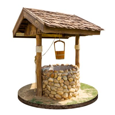 Rustic stone water well with wooden roof and bucket.