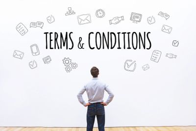 Man reading terms and conditions with icons.