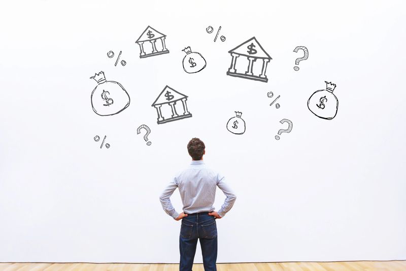 choosing bank for credit or loan, business man comparing credit percentage offers for company, financial concept, mortgage