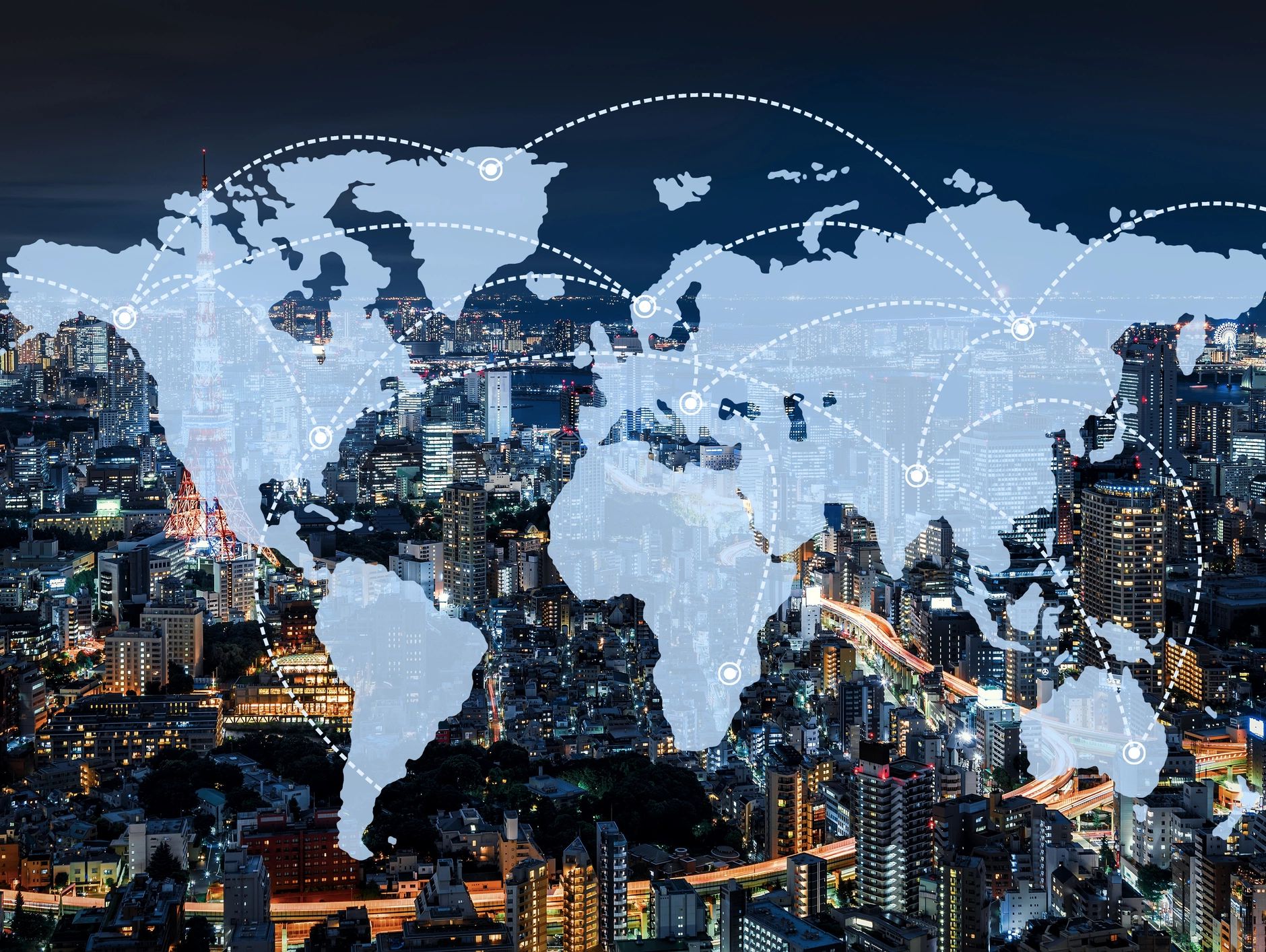 Global network connections over cityscape at night with world map overlay.