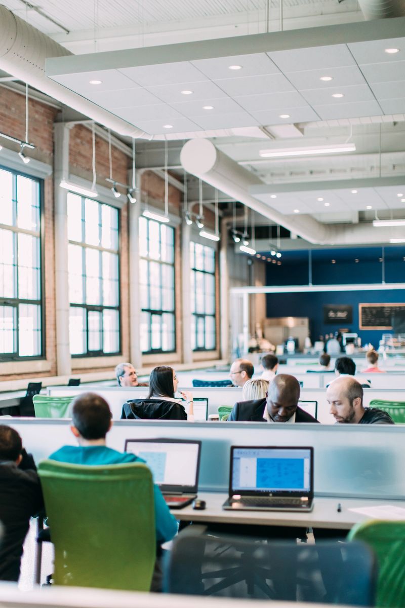 Multi-ethnic group studying, brainstorming, working together or having a business meeting. Startup. Bring your own device area. Open plan