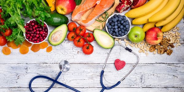 Colorful food and stethoscope symbolizing the critical role nutrition plays in health and function