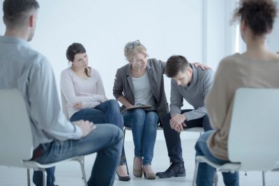 Group therapy session with emotional support.