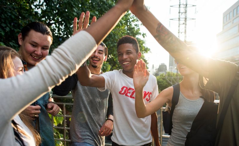 Friends giving high fives