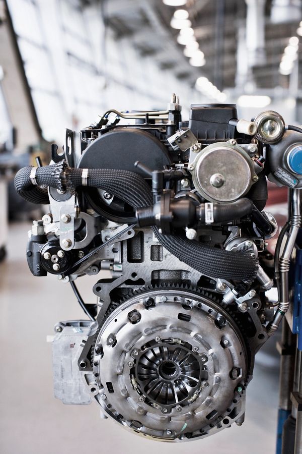 Close-up of a mechanical engine in a workshop.
