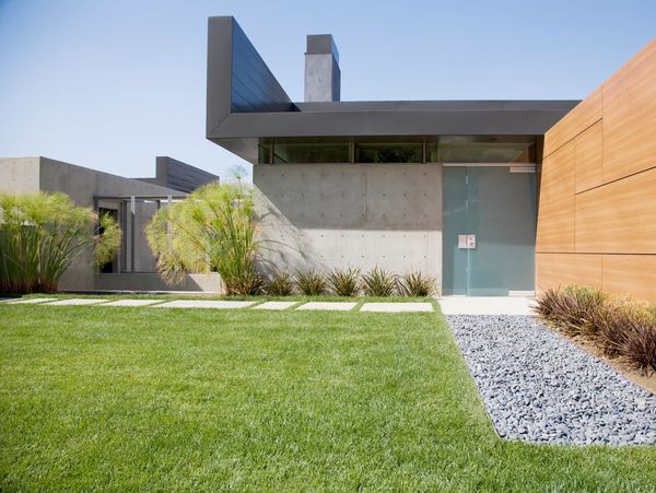 Modern house with clean architectural lines and landscaped yard.