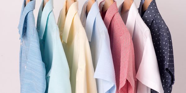 Dry cleaned shirts, hanging and ready to be processed