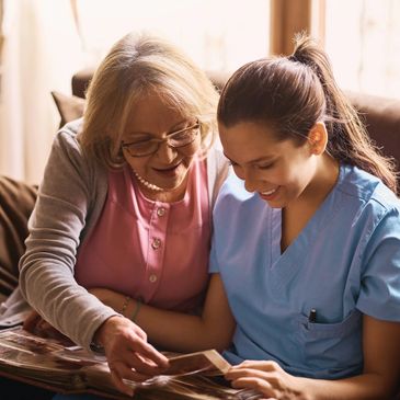 Family caregiver assisting elderly woman with memory care