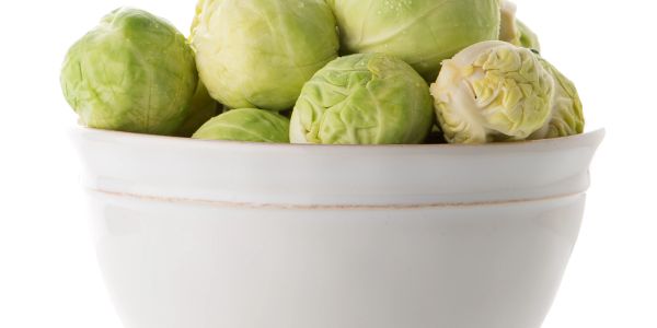Bowl filled with fresh Brussels sprouts.