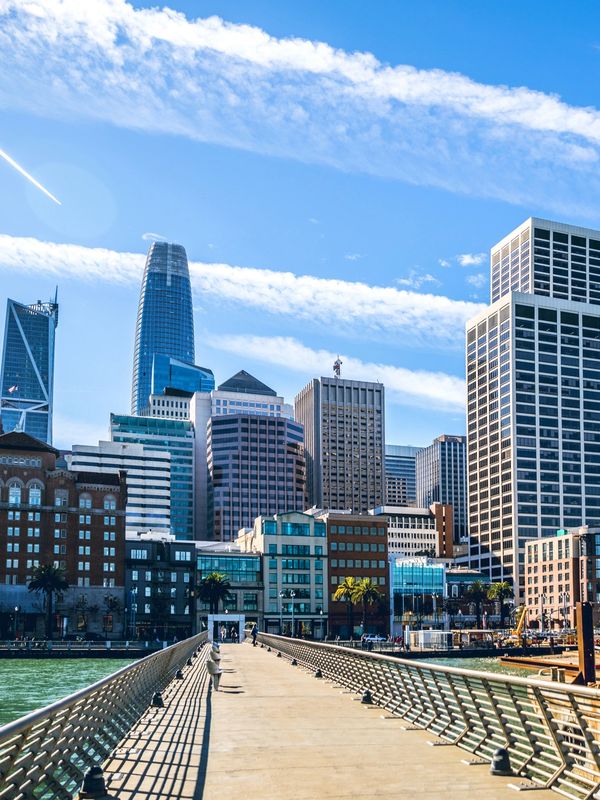 San Diego waterfront skyline with boardwalk, featuring key venues for conventions and events.
