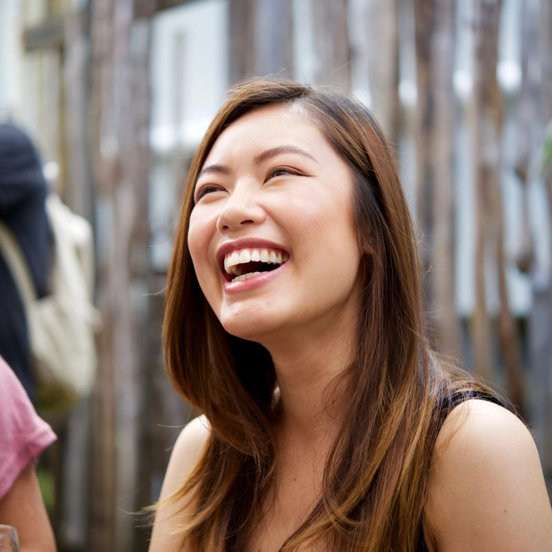 Diverse female workers drinking wine outside in summer