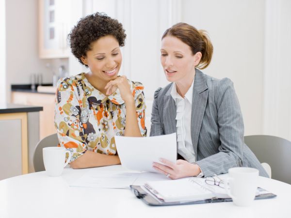Business professional reviewing insurance paperwork.