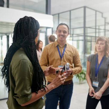 People engaging in a discussion in a modern office space.