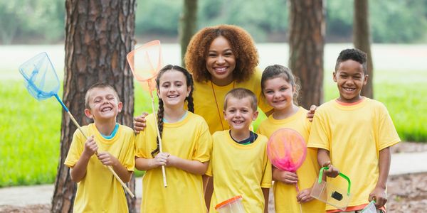 Happy children enjoying outdoor summer activities.