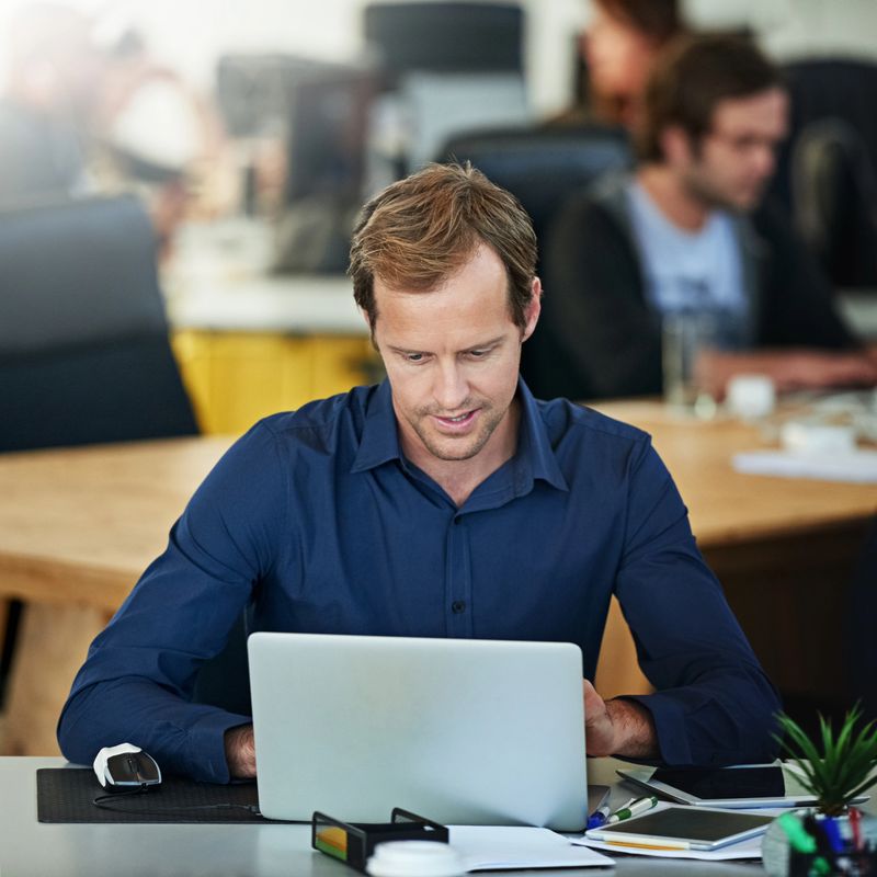 Cropped shot of a handsome mature businessman working on his laptop in the office
