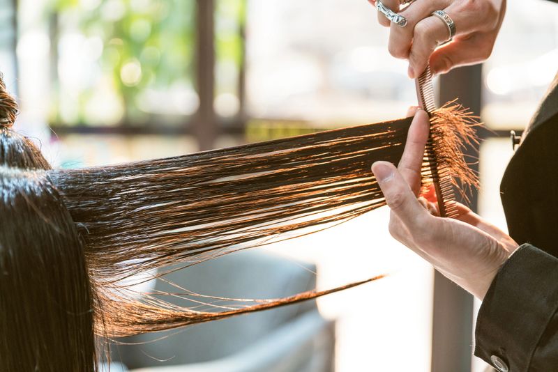 Woman getting her hair styled and hair salon.