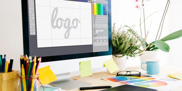 Graphic design workspace with a computer. Business printing, personalized printing, and custom printing