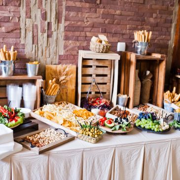 A buffet table with various appetizers and snacks.