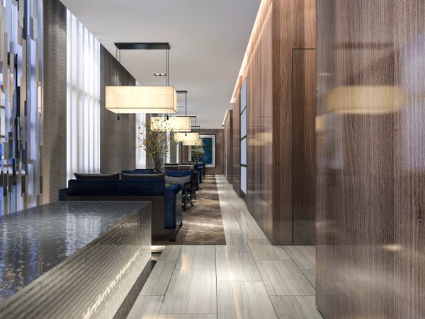 Modern lounge area with sleek lighting and reflective surfaces.