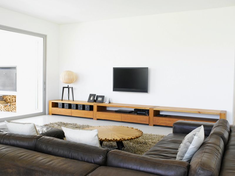 Sofa and television in living room of modern home