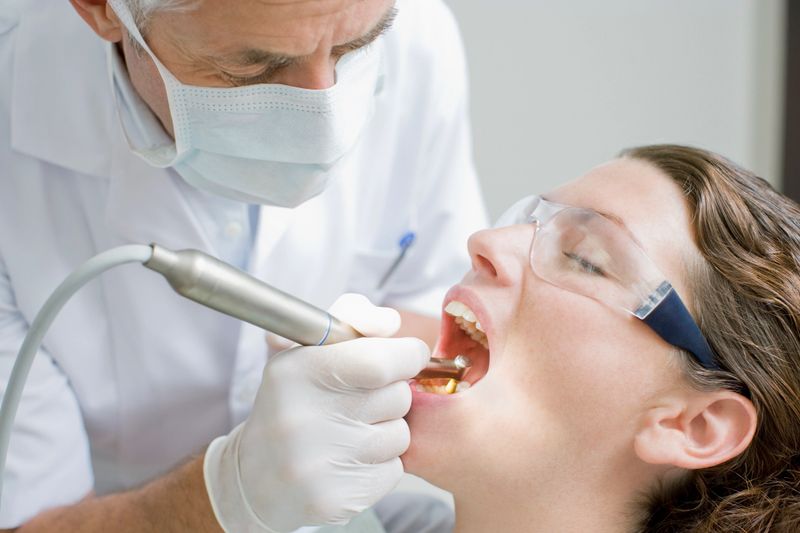 Dentist working on patients teeth