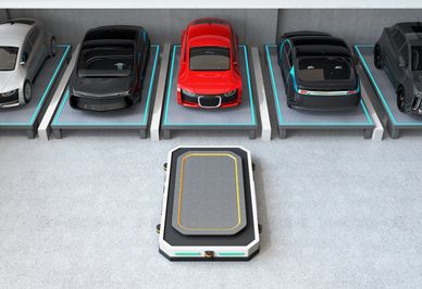 Aerial view of an automated robotic parking system with vehicles on lift platforms