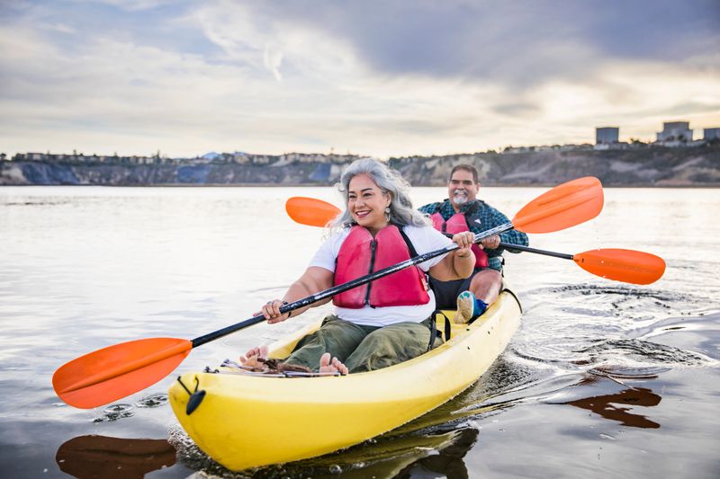 A beautiful senior Mexican couple kayaking