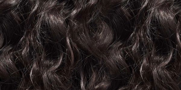 Close-up of dark, wavy hair strands.